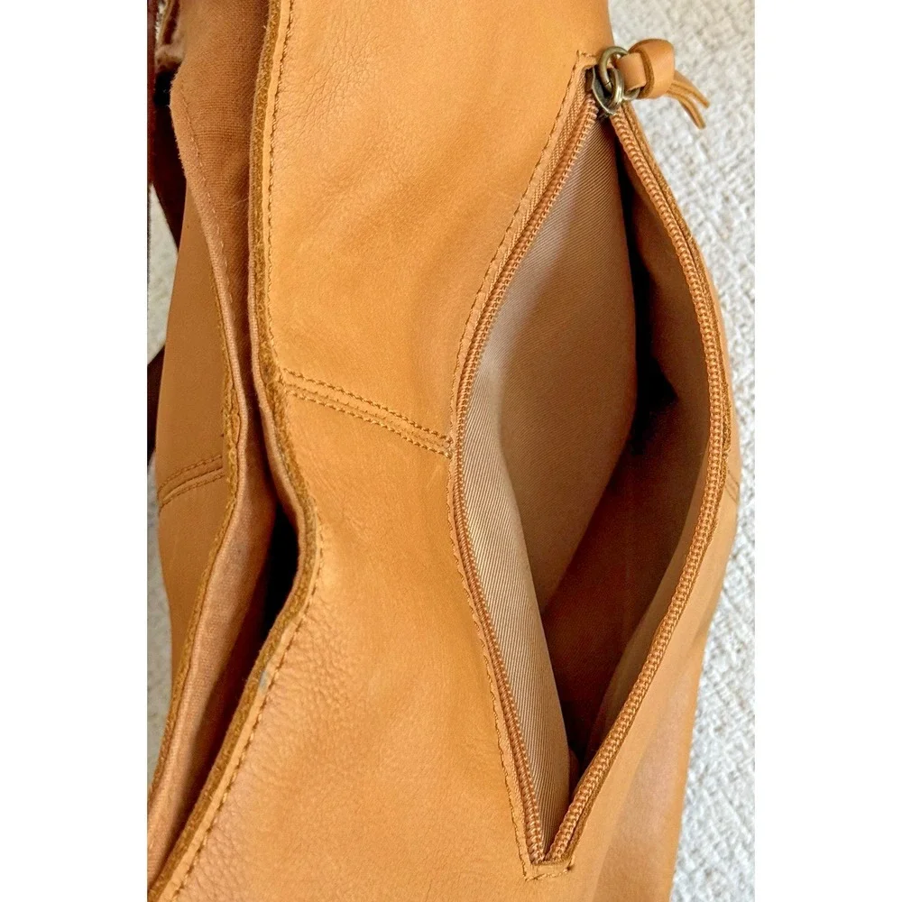 The Sak Women's Huntley‎ Leather Hobo Bag Metro Sling Pebbled Tan with Tassel